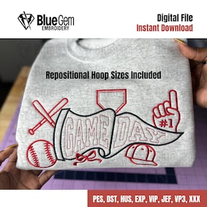 May include: A gray sweatshirt with a baseball-themed design. The design includes the words "GAME DAY" in a banner, a baseball, bats, a baseball cap, and a hand with the number one. The words "Digital File Instant Download" are also visible.