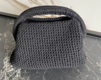 Gehaakte clutch met handvat