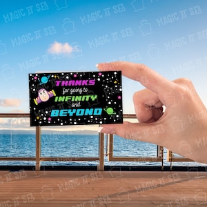 May include: A black thank you card with a cartoon image of Buzz Lightyear from Toy Story. The card says "Thanks for going to Infinity and Beyond".