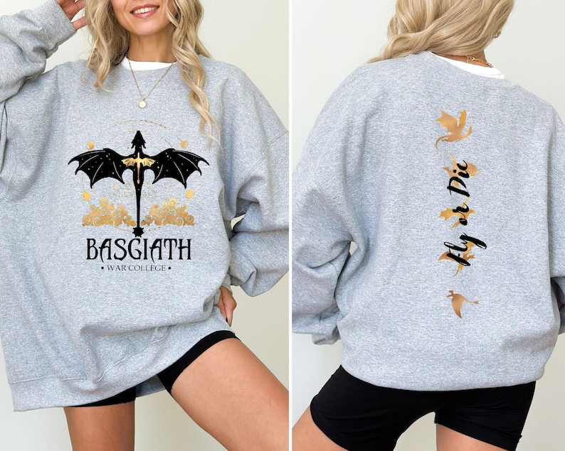 May include: A gray sweatshirt with a black dragon graphic on the front and the text "BASGIATH WAR COLLEGE". The back of the sweatshirt has a gold dragon graphic and the text "Fly or Die".