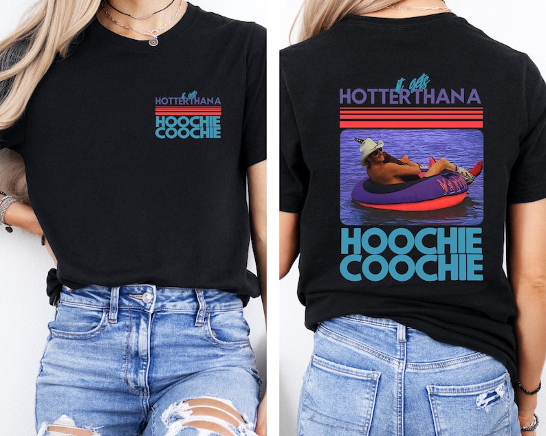 May include: Black t-shirt with the text "HOTTERTHANA HOOCHIE COOCHIE" in purple, red, and blue. The back of the shirt features a graphic of a person in a tube on the water with the same text.