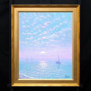 May include: An oil painting in a gold frame depicting a seascape with three sailboats on a calm, light blue sea under a pastel pink and blue sky with textured clouds. The sun is low on the horizon, and the artist's signature is in the bottom right.