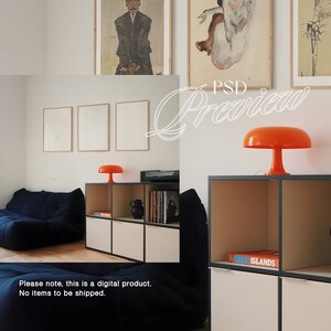 May include: A living room interior featuring a blue sofa, a wooden shelving unit with a black frame, and an orange mushroom lamp. The shelf unit displays a book titled "New Islands" and a black vase. Framed pictures adorn the wall.