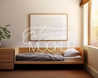May include: A wooden bed frame with a gray mattress and a white pillow. A framed picture hangs on the wall behind the bed. The picture has a white background and a wooden frame.
