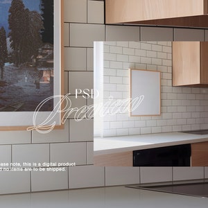May include: A white kitchen with white subway tile backsplash, a wood cabinet, and a framed picture. The picture is blank and can be used for a mockup.