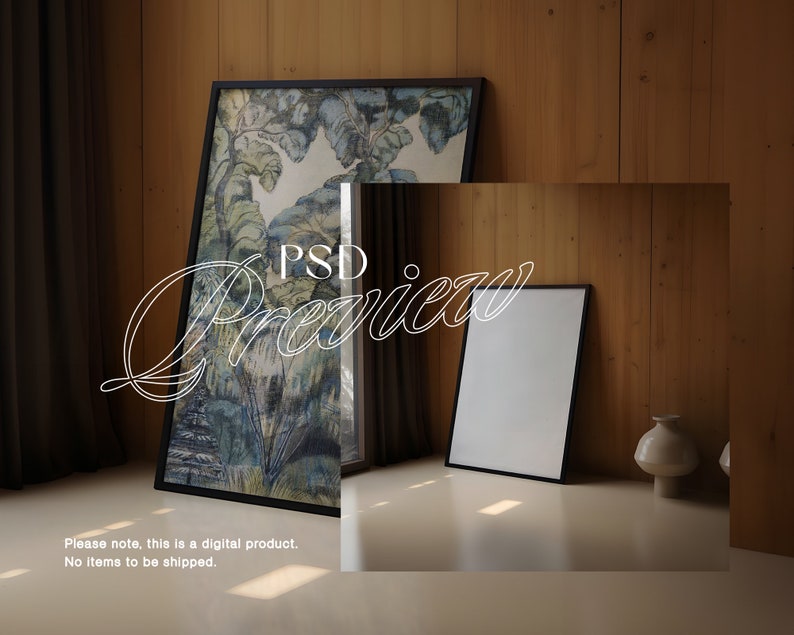 May include: A black framed picture with a watercolor painting of a forest scene. A smaller black framed picture is on the floor in front of the larger picture. A white vase is on the floor to the right of the smaller picture.