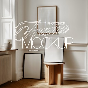 May include: Three picture frames in a white room with a wooden floor. The frames are empty and have black frames. The largest frame is on a wooden stool. The text "Photoshop Frame Mockup DIN A Ratio" is written in white on the wall.