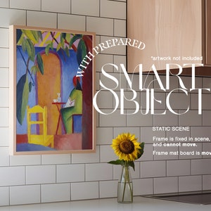 May include: A framed painting of a colorful abstract scene with a person sitting at a table. The frame is made of wood and has a light brown finish. The painting is hanging on a white tiled wall. A sunflower in a glass vase is on a white countertop below the painting. The text "WITH PREPARED SMART OBJECT STATIC SCENE Frame is fixed in scene, and cannot move. Frame mat board is movable." is visible in the image.