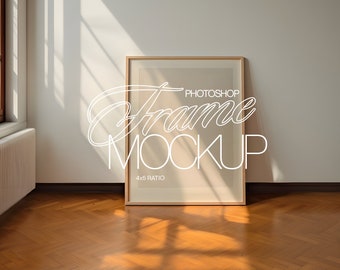 May include: A wooden frame mockup with a 4x5 ratio, sitting on a hardwood floor with natural light streaming in from a window. The text "Photoshop Frame Mockup" is written in white on the frame.