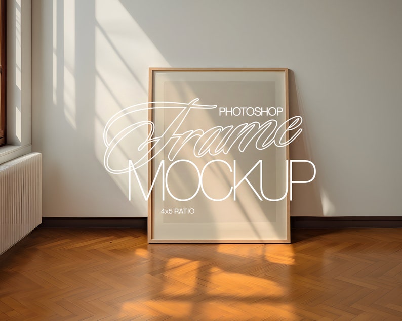 May include: A wooden frame mockup with a 4x5 ratio, sitting on a hardwood floor with natural light streaming in from a window. The text "Photoshop Frame Mockup" is written in white on the frame.