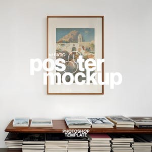 May include: A framed poster mockup with a landscape scene, featuring a mountain and building, hangs on a white wall. The text "poster mockup" is overlaid on the image. A wooden shelf below holds books, with the text "Photoshop Template".