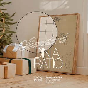 May include: A framed print with black and white calligraphy on a beige background. The print is hanging on a white wall next to a Christmas tree with white lights. There are three wrapped gifts in front of the print, one with a gold ribbon and two with green ribbon.