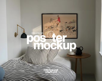 May include: A bedroom scene featuring a bed with black and white striped bedding and pillows. A framed artwork hangs above the bed. A small wooden side table holds a black pitcher and a white teacup. The text "DIN A RATIO poster mockup" is visible.