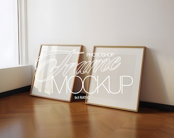 May include: Two gold picture frames with white mats on a wooden floor. The frames are empty and ready for your photos. The text "PHOTOSHOP FRAME MOCKUP 1x1 RATIO" is written in white on the floor.