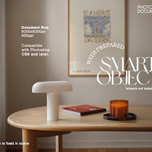 May include: A white table lamp with a rounded top and cylindrical base sits on a light wood table. A framed artwork hangs on the wall. A red book and a candle in a glass jar are also on the table. The image includes the text "Document Size 5000x5000px 300ppi Compatible with Photoshop CS6 and later."