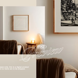 May include: A bedroom interior with two beds, a nightstand with a lamp, and a framed black and white print on the wall. The beds are covered with brown blankets and white pillows. The nightstand is made of wood and has a small lamp on top. The framed print is of a scene with a house and people walking.