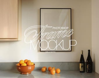 DIN A Black Frame Photoshop Wall Art Mockup in Luxury Kitchen Scene with Oranges | ISO A2 Black Frame PSD Template