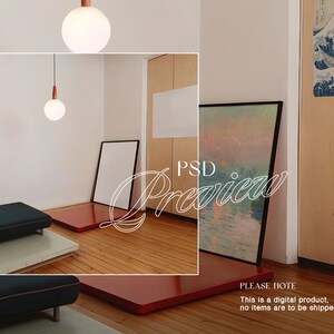 May include: A minimalist living room interior with two hanging light fixtures, a red rug, and two framed paintings. One painting is a landscape with a sunset and the other is a blank canvas. The text "PSD Preview" is written in white on the image.