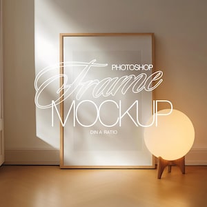 May include: A wooden frame mockup with a white background and the text "Photoshop Frame Mockup DIN A Ratio" in the center. A white globe lamp with a wooden stand is in the foreground.