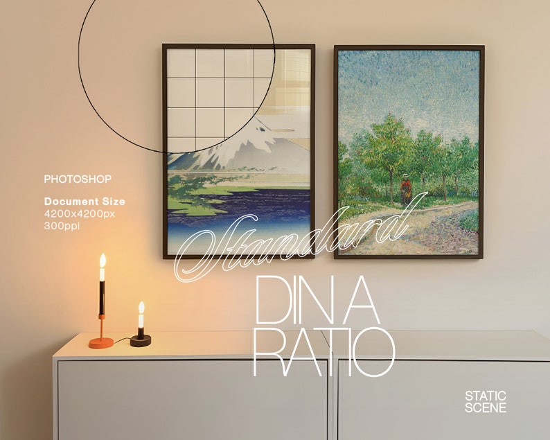 May include: Two framed paintings hanging on a light beige wall above a white dresser. The painting on the left depicts a mountain scene with a blue lake and a white mountain peak. The painting on the right depicts a green forest scene with a single figure walking on a path. The text "Standard DIN A Ratio" is written in white cursive letters on the wall below the paintings.
