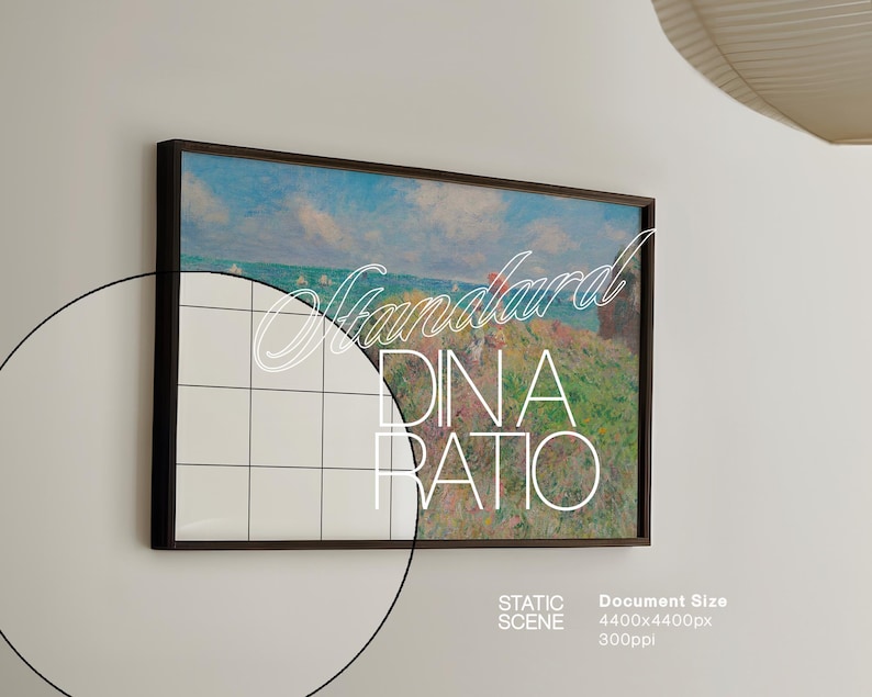 May include: A framed painting depicting a seascape with a blue sky, white clouds, and a distant shoreline. The painting is in a dark brown frame and is hanging on a white wall. The text "Standard DIN A Ratio" is superimposed on the image.