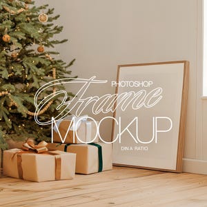 May include: A white frame mockup with the text "Photoshop Frame Mockup DIN A Ratio" on a white background with a Christmas tree and wrapped gifts in the foreground.