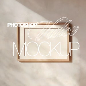 May include: A light brown wooden frame with a white background. The text "PHOTOSHOP VIDEO MOCKUP" is written in white on the frame.
