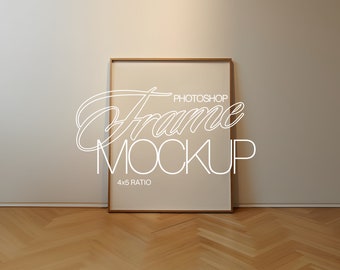 May include: A simple, light brown wood frame mockup with a white background and the text "Frame Mockup" and "4x5 Ratio" in white. The frame is on a light brown wood floor.