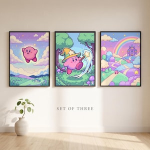Peut inclure: Un ensemble de trois impressions murales encadrées présentant des illustrations en pixel art d'un personnage rose. La première montre le personnage dans le ciel, la deuxième avec un chapeau étoilé et une baguette, et la troisième un château.