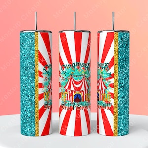 May include: A white tumbler with a red and white striped background. The tumbler has a gold glitter stripe and a turquoise glitter stripe. The tumbler has a graphic of a circus tent with the text "Ringmaster of the Shit Show".