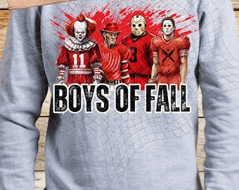 May include: A gray sweatshirt with a graphic design of four horror movie characters in football uniforms. The characters are wearing red and white jerseys with numbers and have a bloody red background. The text "BOYS OF FALL" is printed below the characters.