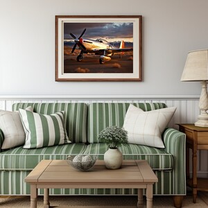 May include: A framed photograph of a silver airplane with red accents, flying over a desert landscape with a cloudy sky in the background.