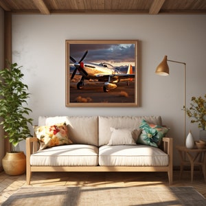 May include: A framed photograph of a silver airplane with red accents, flying over a desert landscape. The airplane is in focus, while the background is blurred. The photograph is hanging on a wall in a living room setting.