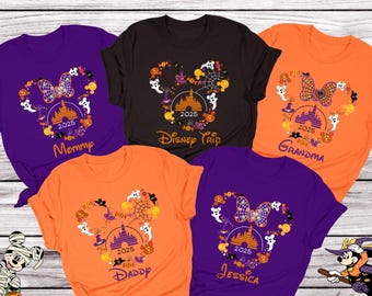 May include: Five orange, purple, and black t-shirts with a Mickey Mouse head design featuring a Halloween theme. The shirts have the text "Mommy", "Daddy", "Grandma", "Jessica", and "Disney Trip" printed on them.