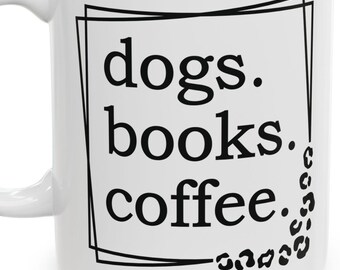 May include: White ceramic coffee mug with black text that reads "dogs. books. coffee." inside a black frame. The frame is decorated with black leopard print spots.