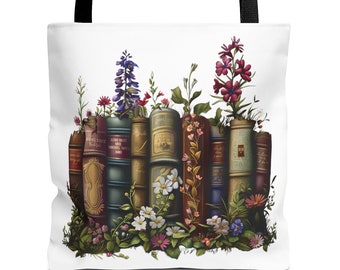 May include: A white tote bag with a design of a row of vintage books with flowers growing out of them. The flowers are in shades of pink, purple, and white.