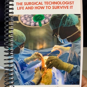 May include: A book titled "The Surgical Technologist Life and How to Survive It" with a photo of two surgeons in an operating room. The book cover also says "O.R. Scrub Life" and "For Surgical Tech Students & New Grads".