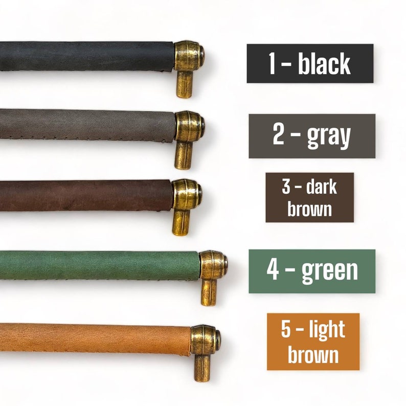 May include: Five leather cabinet pulls with brass hardware in black, gray, dark brown, green, and light brown.