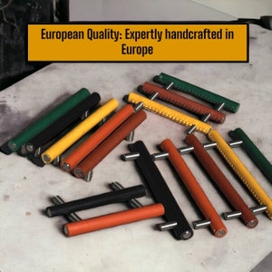May include: Assortment of leather cabinet pulls in various colours, including black, green, yellow, brown, and orange. The pulls have a stitched design and metal hardware. European Quality: Expertly handcrafted in Europe.