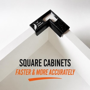 May include: A black L-shaped corner clamping tool positioned on the corner of two white boards. The tool features a logo and the text 'AR IDOM SOREVITA'. Below, the text reads 'SQUARE CABINETS FASTER & MORE ACCURATELY' with an orange underline.