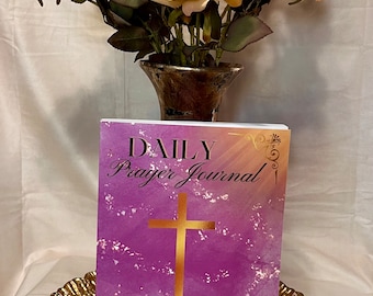 May include: A purple and gold daily prayer journal with a cross and the text "DAILY Prayer Journal" and "90 DAYS OF PRAYER & REFLECTION".