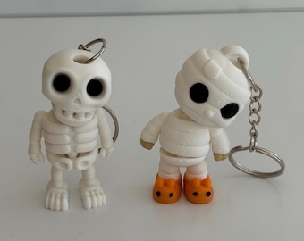 3D-geprinte Halloween-sleutelhanger: skelet of mummie met konijnenpantoffels