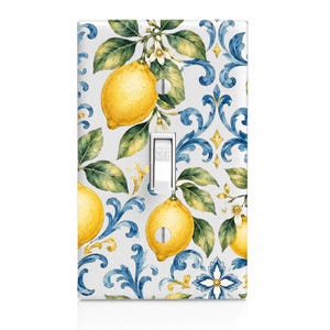 May include: A rectangular light switch cover plate featuring a white background with a repeating pattern of yellow lemons, green leaves, white blossoms, and intricate blue scrollwork. A white toggle switch is centered with the word OFF printed on it.