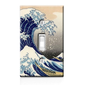 May include: A light switch cover featuring a blue and white illustration of a large wave crashing against a mountain. The wave is depicted in a traditional Japanese style, with a sense of movement and energy. The switch cover is made of durable plastic and is easy to install.