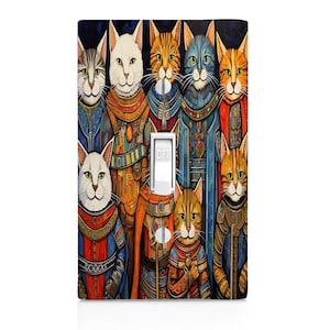 May include: A light switch cover featuring a colorful illustration of eight cats dressed in medieval-style clothing. The cats are arranged in a row, with the light switch in the center. The cats are all wearing different colors and patterns, and some are holding swords or other weapons. The background is a dark blue color.
