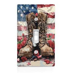 May include: A light switch cover featuring a pair of brown combat boots with red roses in front of an American flag. The switch is in the "OFF" position. The background is a painted style.