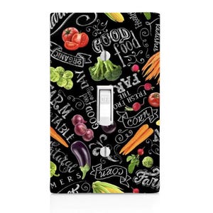 May include: Black and white light switch cover with a chalkboard design featuring colorful vegetables, fruits, and the text "GOOD Food every DAY", "FRESH FRO THE FAR", "CORN", "Radishes", "ORGANIC", "FARM TABLE", "Natural", "MERS", and "corn".