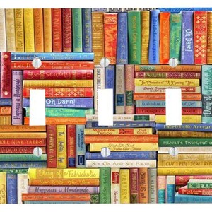 May include: A triple light switch wall plate featuring a colourful, repeating pattern of book spines with various sewing-themed titles like 'Let It Sew', 'Oh Darn!', and 'Diary of a Fabricholic'. The rectangular plate has three vertical cutouts.