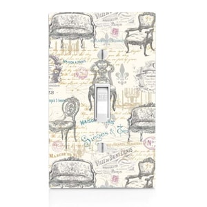 May include: A light switch cover with a vintage Parisian design featuring a repeating pattern of chairs, couches, and text in French. The text includes "Maison a Paris", "Ville de Saint Denis", and "Sieges & Ter", among others.