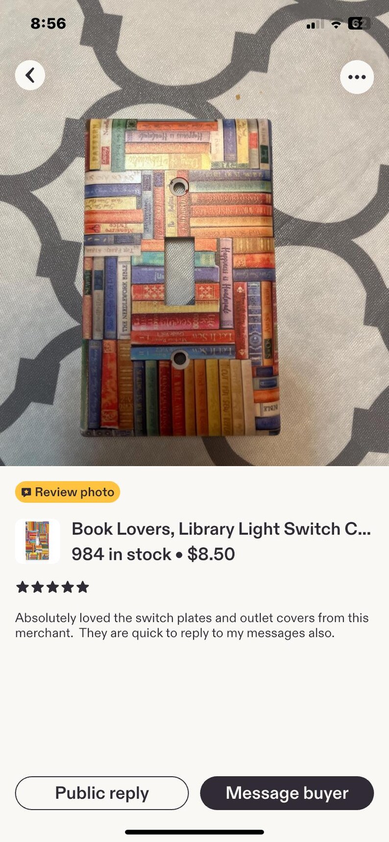 May include: A rectangular light switch cover plate featuring a colourful, multi-directional pattern of stacked book spines in various shades of red, blue, green, yellow, and orange. The plate has two screw holes and a central rectangular toggle cutout.